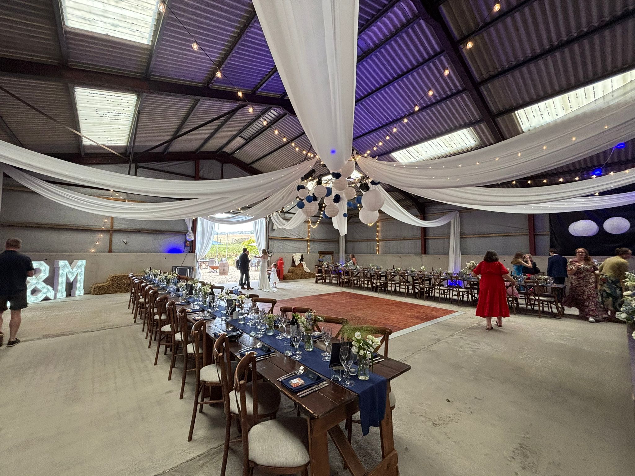 Wedding reception arranged inside a barn at Hewletts Farm
