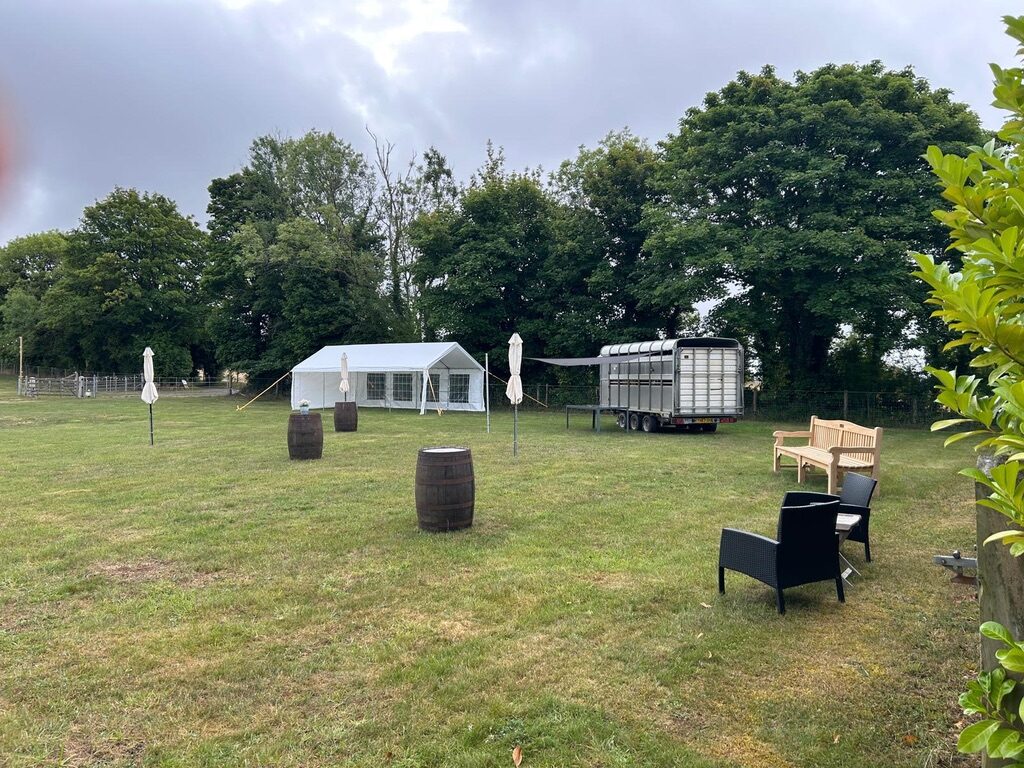 House and lawn prepared with chairs for a ceremony